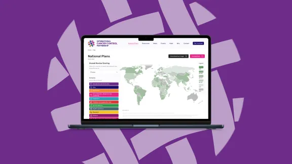 A laptop showing the map of national cancer control plans of the iccp-portal.org on a purple background